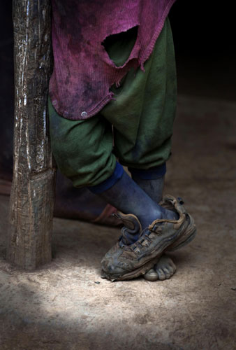 a-child-stands-at-his-hom-haiti1