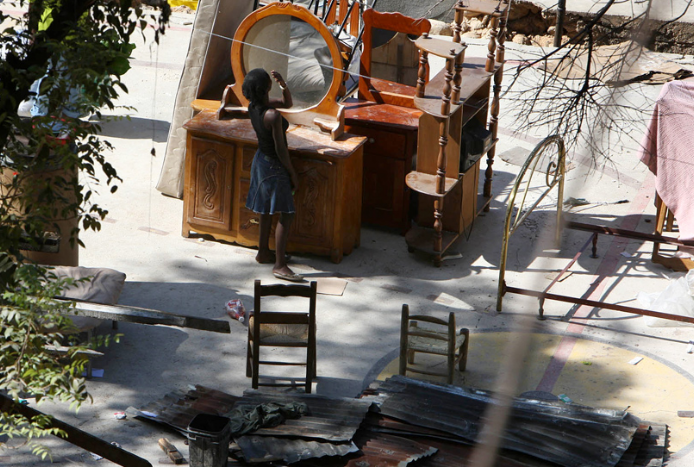 woman looking in mirror, Haiti