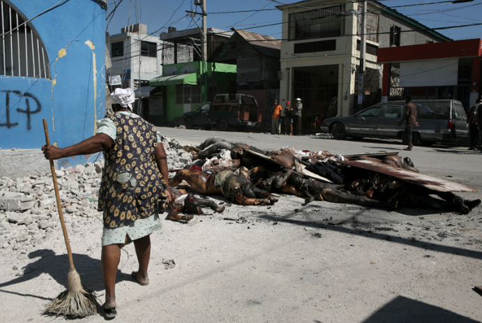 woman sweeping, Haiti