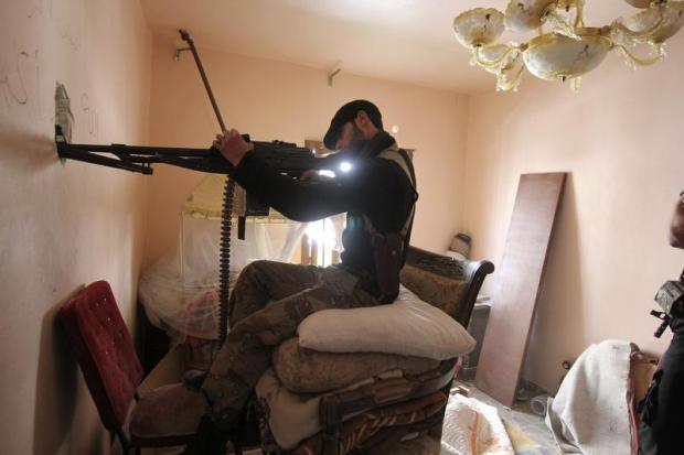 Syrian rebel fighter in house