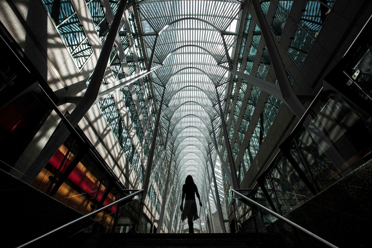 A woman walks through Brookfield Place off Bay Street, on the day of their annual general meeting for shareholders in Toronto