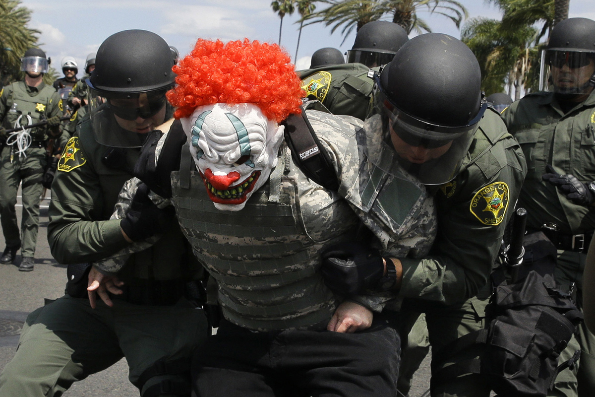 Orange County Sheriff's deputies take a protester into custody near the Anaheim Convention Center Wednesday, May 25, 2016, in Anaheim, Calif., after Republican presidential candidate Donald Trump held a rally at the convention center. (AP Photo/Jae C. Hong)